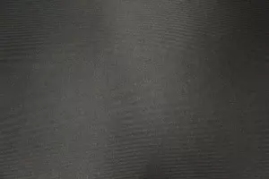 Tissu jean envers mousse sur résille noir.